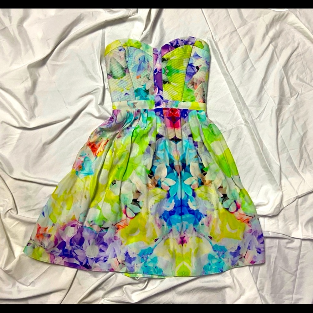 100% silk.  Beautiful dress. Great cond.